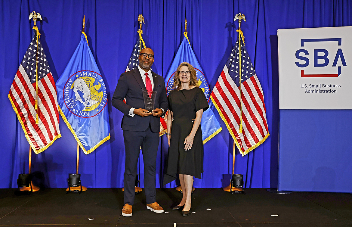 Middle Tennessee State University alumnus Reggie Polk, left, receives the Tennessee Small Business Administration Person of the Year Award for 2025 in Washington, D.C., on Monday, May 5, from Lisa Shimkat, U.S. Small Business Administration Office of Field Operations associate administrator. A 1993 graduate of the MTSU concrete program, Polk owns Polk and Associates Construction Inc. (Photo by Brian Ach Photography Inc.)