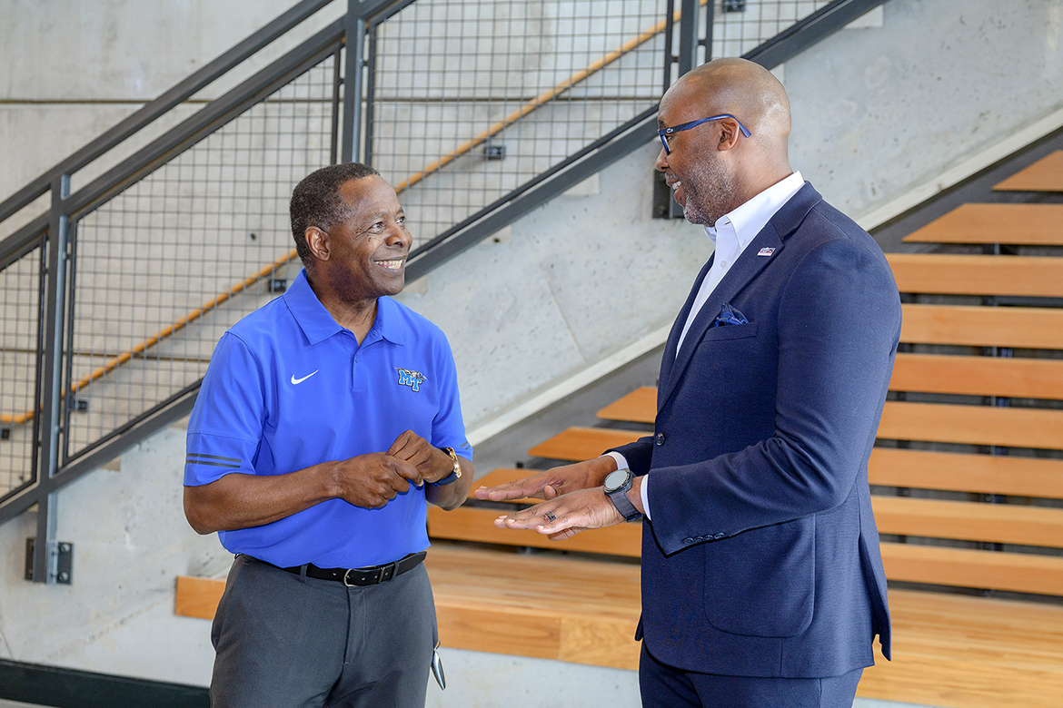 Alumnus Reggie Polk, right, shares with Middle Tennessee State University President Sidney A. McPhee about being recognized with the 2025 Tennessee Small Business Administration Person of the Year award in the atrium of the School of Concrete and Construction Management Building on the campus in Murfreesboro, Tenn., on Friday, May 2. Polk received the award in Washington, D.C., on Monday, May 5, during a banquet recognizing every state’s winner. (MTSU photo by J. Intintoli) 