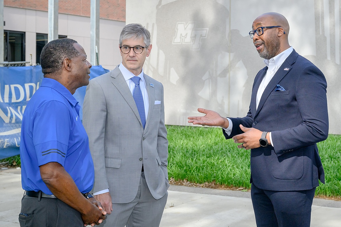 Alumnus Reggie Polk, right, of Nashville, Tenn., the 2025 Tennessee Small Business Administration Person of the Year, talks about his time as a student in the Middle Tennessee State University concrete program with MTSU President Sidney A. McPhee, left, and College of Basic and Applied Sciences Dean Greg Van Patten when visiting campus Friday, May 2, in Murfreesboro, Tenn. The owner of Polk and Associates Construction Inc., in Brentwood, Tenn., is a former Blue Raider football player. (MTSU photo by J. Intintoli)