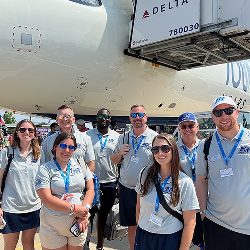 Part of the delegation representing the Aerospace Department of Middle Tennessee State University in Murfreesboro, Tenn., participate in a Delta Propel VIP tour of the airline’s brand new A321 jet with exterior painted to celebrate carrier's 100th anniversary. The plane was on display at the 72nd EAA AirVenture aviation showcase held July 21-27 in Oshkosh, Wisc. MTSU is a member of the Delta Propel program, which provides participating students with fast tracks to jobs upon graduation. (MTSU photo by Andrew Oppmann)