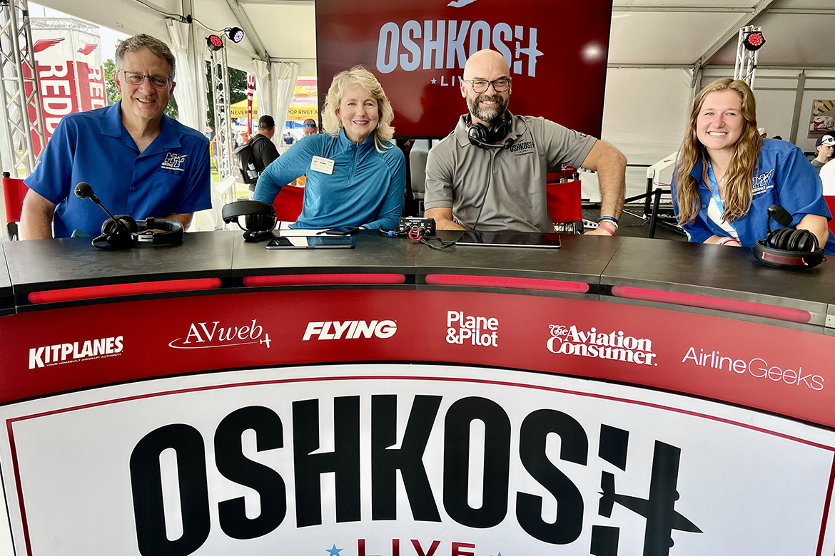 Mark Byrnes, left, provost of Middle Tennessee State University in Murfreesboro, Tenn., is joined by MTSU Aerospace Department alumna and current flight instructor Hailey Harrison, right, for a broadcast of the Oshkosh Live livestreamed TV program during the 72nd EAA AirVenture aviation showcase held July 21-27 in Oshkosh, Wis. Interviewing them are co-hosts Teresa de Mers, center left, and Shawn Bean, center right. (MTSU photo by Andrew Oppmann)