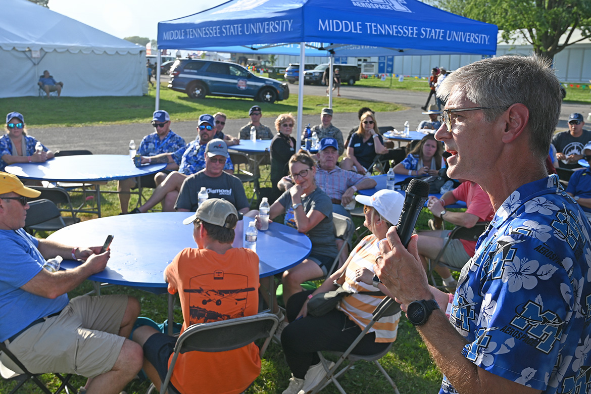 Greg Van Patten, dean of the College of Basic and Applied Sciences at Middle Tennessee State University in Murfreesboro, Tenn., addresses the crowd of alumni attending a university-hosted barbecue on site at the 72nd EAA AirVenture aviation showcase held July 21-27 in Oshkosh, Wis. MTSU Aerospace returned to the event with a delegation of faculty, staff and students to showcase the aerospace program, reconnect with alums and network with industry leaders. (MTSU photo by Andrew Oppmann)