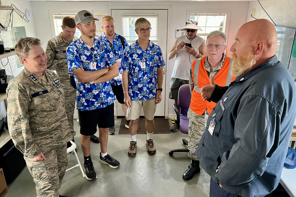 Civil Air Patrol Commanding General Regena Aye, left, takes Middle Tennessee State University Basic and Applied Sciences Dean Greg Van Patten, center, and a small group of university representatives on a tour of the Air Force auxiliary’s base during the MTSU Aerospace Department’s visit to the 72nd EAA AirVenture aviation showcase held July 21-27 in Oshkosh, Wis. (MTSU photo by Andrew Oppmann)