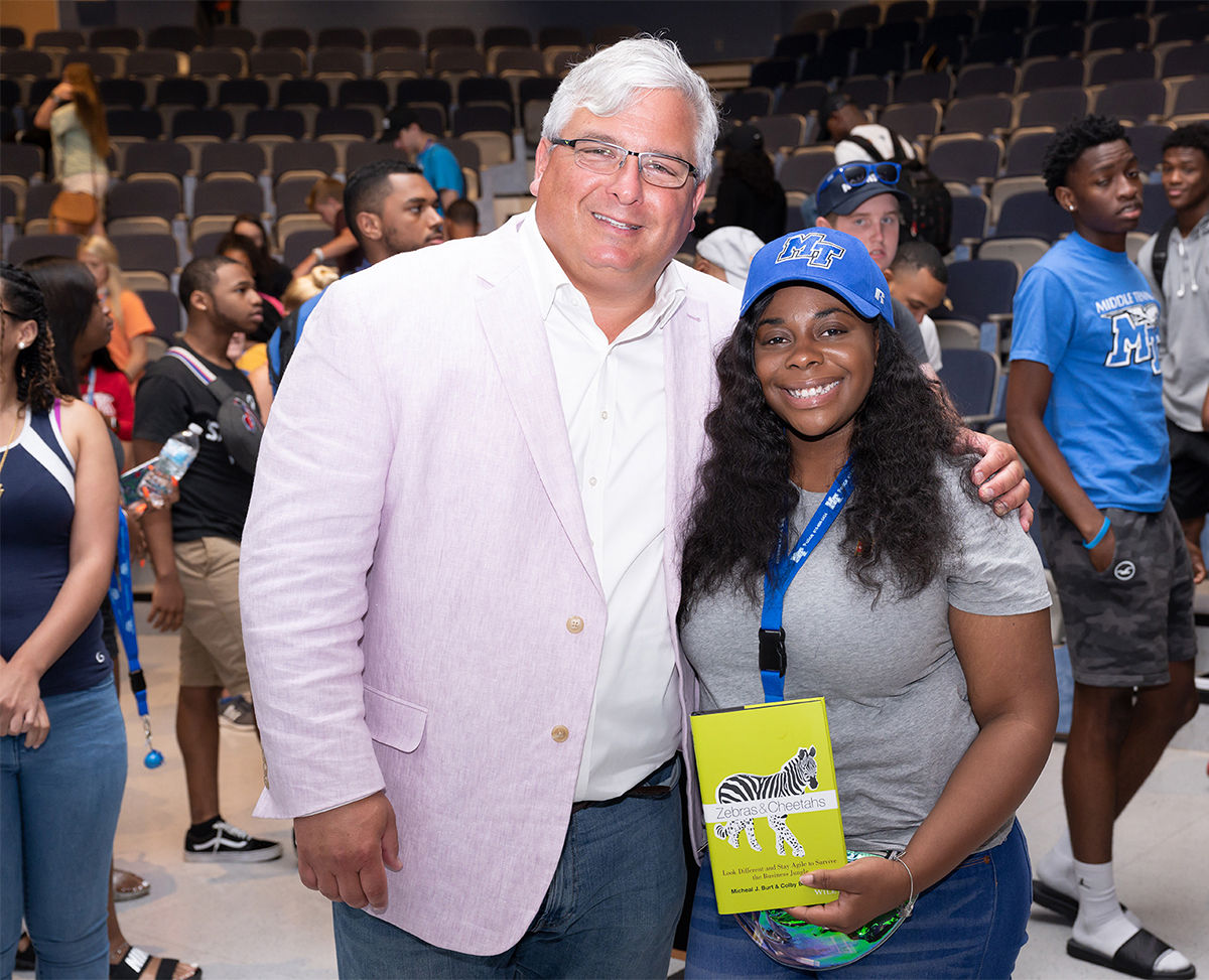 MTSU professor and Center for Student Coaching and Success Director Colby Jubenville, left, is shown after giving a copy of one of his books to Faith Knox of Memphis, Tenn., Monday, Aug. 19, in the LRC as part of a STAR — Student Transition and Academic Readiness Program — session. (MTSU photo by James Cessna)