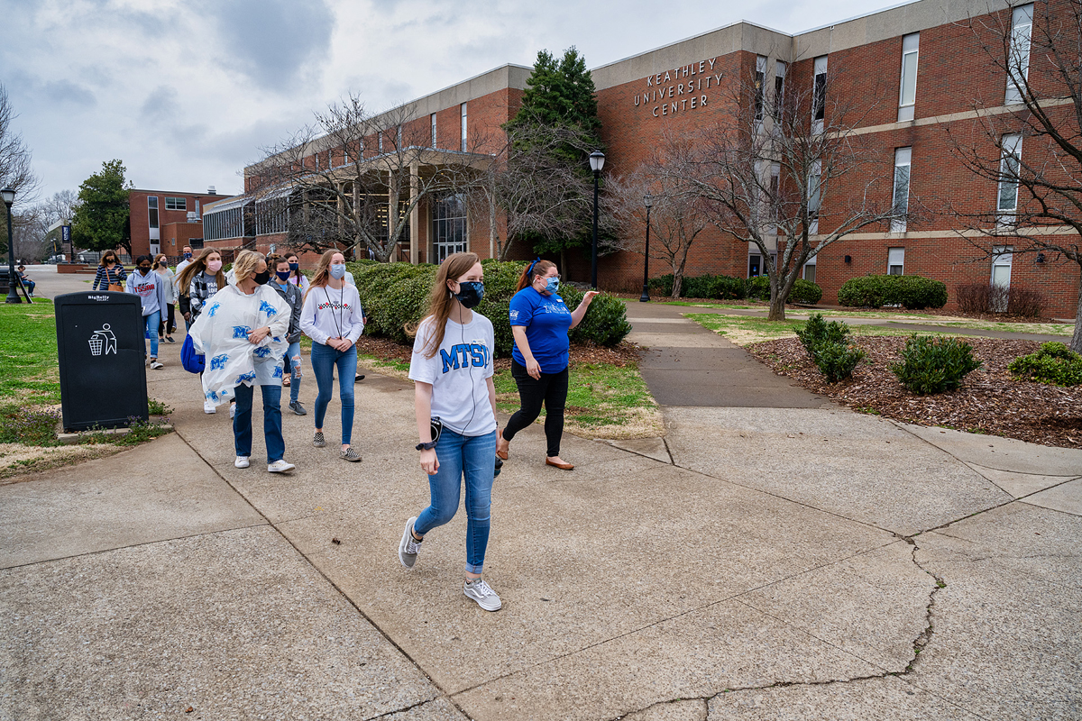 MTSU student tour guides Ashley Conser, left, and Miura Rempis lead in-person daily campus tour, as the group walks past Keathley University Center. MTSU will host two True Blue Preview events, one Saturday, Sept. 25, and the second on Nov. 6 (MTSU file photo by Andy Heidt)