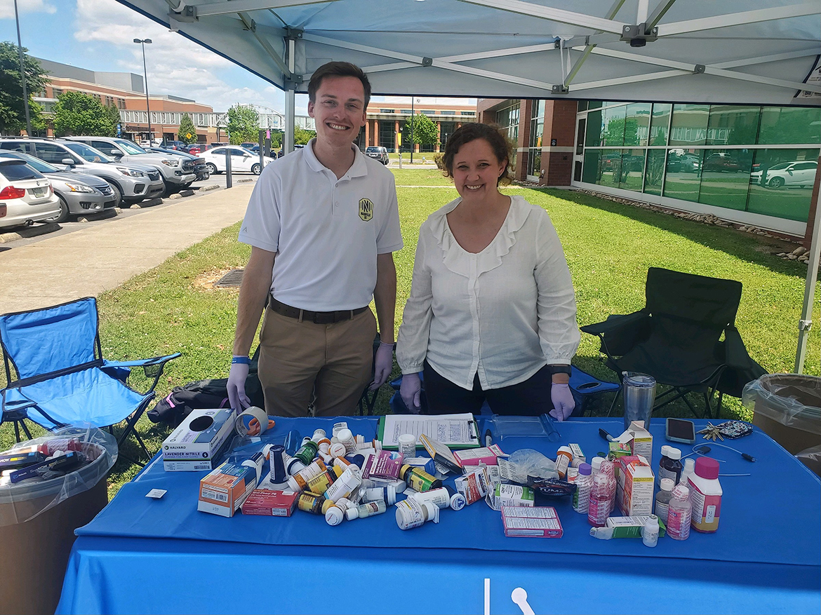 In this spring 2024 file photo, Chipper Smith, left, senior project coordinator in the Middle Tennessee State University Office of Prevention Science and Recovery, and MTSU Pharmacist Tabby Ragland are shown with a portion of nearly 77 pounds of medications collected during the spring Prescription Drug Take-Back Day held near the Campus Pharmacy drive-thru outside the Health, Wellness and Recreation Center on Blue Raider Drive in Murfreesboro, Tenn. The drive included collecting 60 vapes. This year's event is set for 7:30 a.m. to 1 p.m. Wednesday, April 23, 2025, at the same location.  (Submitted photo)