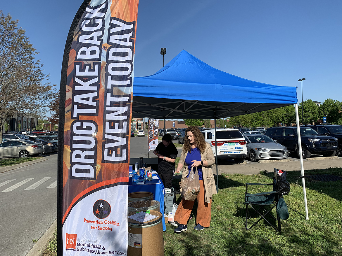 Middle Tennessee State University Campus Pharmacy pharmacist Tabby Ragland, right, carries expired and unwanted medications to the proper containers Tuesday, April 18, during the spring MTSU Drug Take-Back Day event, held near the Campus Pharmacy drive-thru outside the Health, Wellness and Recreation Center. Assisting her at the event and the entire month of April is Lindsey McInturff of Nashville, Tennessee, a fourth-year Lipscomb University College of Pharmacy student. Campus Police and Pharmacy and the MTSU Stormwater Project coordinate the event. (MTSU photo by Randy Weiler)
