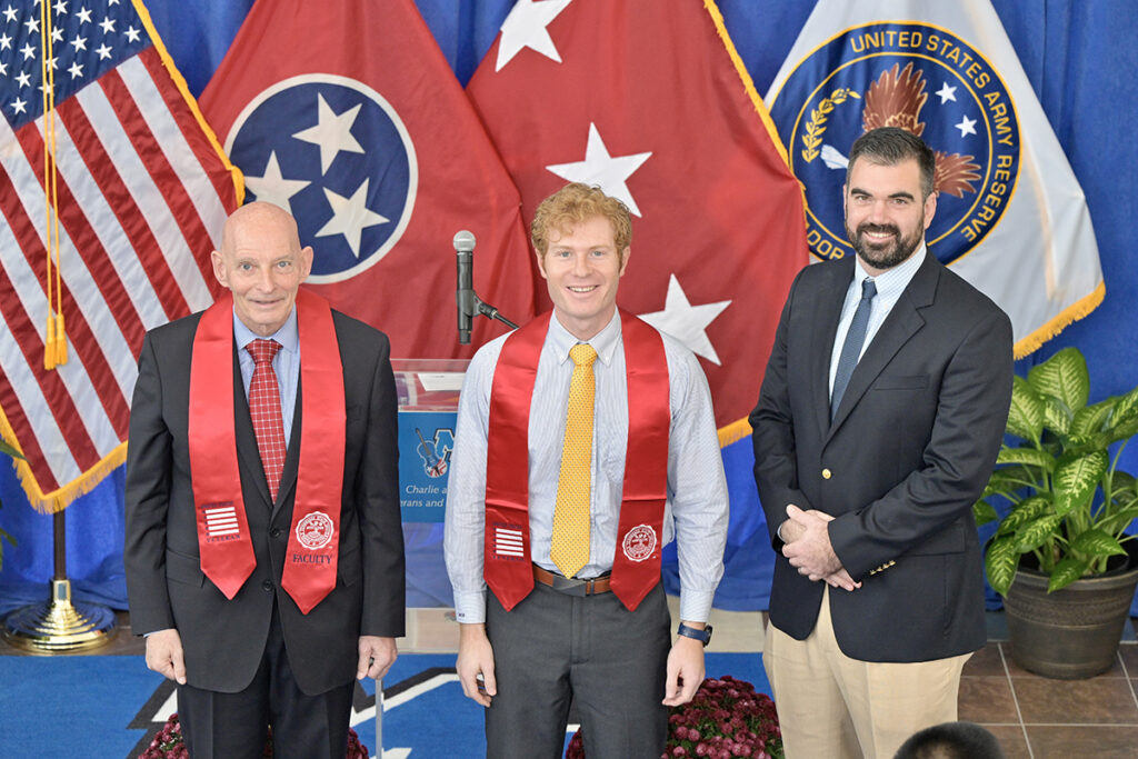 MTSU’s Keith M. Huber, left, graduating veteran Timothy Gassman and guest speaker Scott Lamb are shown during the fall 2021 MTSU Graduating Veterans Stole Ceremony Wednesday, Dec. 1, in the Miller Education Center second-floor atrium. Thirty student veterans, who will be graduating from MTSU on Saturday, Dec. 11, received red stoles to wear during commencement. Huber is senior adviser for veterans and leadership initiatives and a retired U.S. Army lieutenant general. Lamb, a U.S. Navy veteran, is senior program manager for Amazon in Nashville, Tenn. (MTSU photo by Andy Heidt)