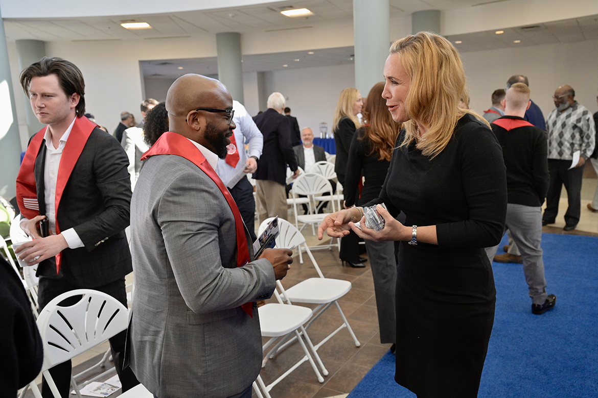 Lorenzo Ellison, left, of Mt. Juliet, Tenn., visits with Hilary Miller, director of Middle Tennessee State University’s Charlie and Hazel Daniels Veterans and Military Family Center, following the fall Graduating Veterans Stole Ceremony Wednesday, Nov. 30, in the Miller Education Center’s second-floor atrium. Ellison, who will graduate from MTSU Saturday, Dec. 10, will earn an MBA from the Jennings A. Jones College of Business. More than 40 student veterans attended the ceremony where they were presented red stoles to wear at graduation. (MTSU photo by Andy Heidt)