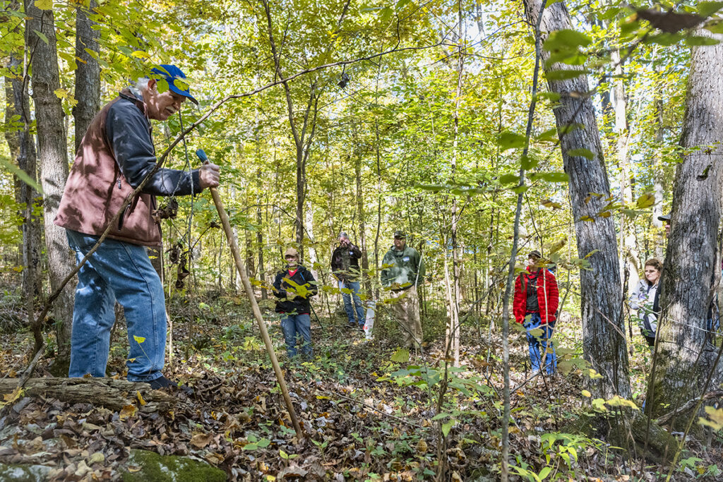 Bob Beyfuss, left, a retired New York state ginseng specialist for the Cornell University Cooperative Extension, shows attendees tips about planting ginseng on a hillside at the 2021 Tennessee Ginseng Growers Workshop at the Barfield Crescent Park Wilderness Station in Murfreesboro, Tenn. The International Ginseng Institute at MTSU will host a Ginseng Workshop and Demo Day on Friday, Oct. 21, at the park. (MTSU file photo by Andy Heidt)