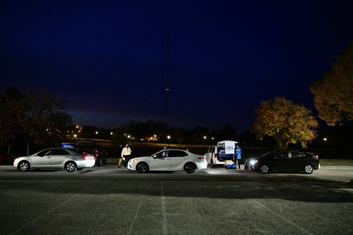 As darkness settles in, cars carrying prospective students participate in the MTSU Drive-Thru College Fair in the Rutherford Parking Lot Thursday, Nov. 5. The event was a way for high school students to learn more about MTSU and other colleges since COVID-19 forced the cancellation of college fairs across the state. (MTSU photo by Andy Heidt)