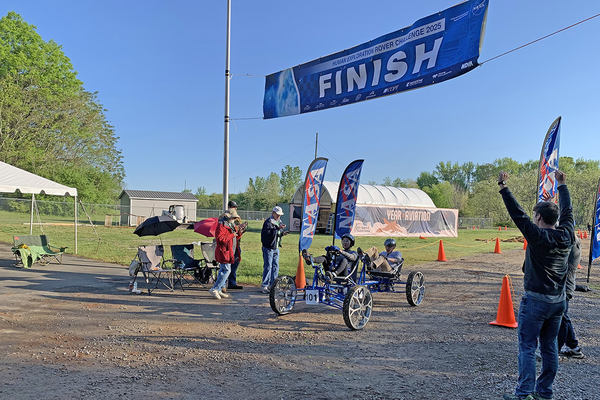 Middle Tennessee State University Engineering Technology Experimental Vehicles lunar rover drivers Angela Thongdinharath, in front seat, and Domonic Dalton cross the finish line, on Friday, April 11, completing the first of two runs in the 31st annual NASA Human Exploration Rover Challenge that concluded Saturday, April 12, at Marshall Space Flight Center in Huntsville, Ala. MTSU placed 13th out of 24 collegiate teams. (MTSU photo by Lydia Ashby)