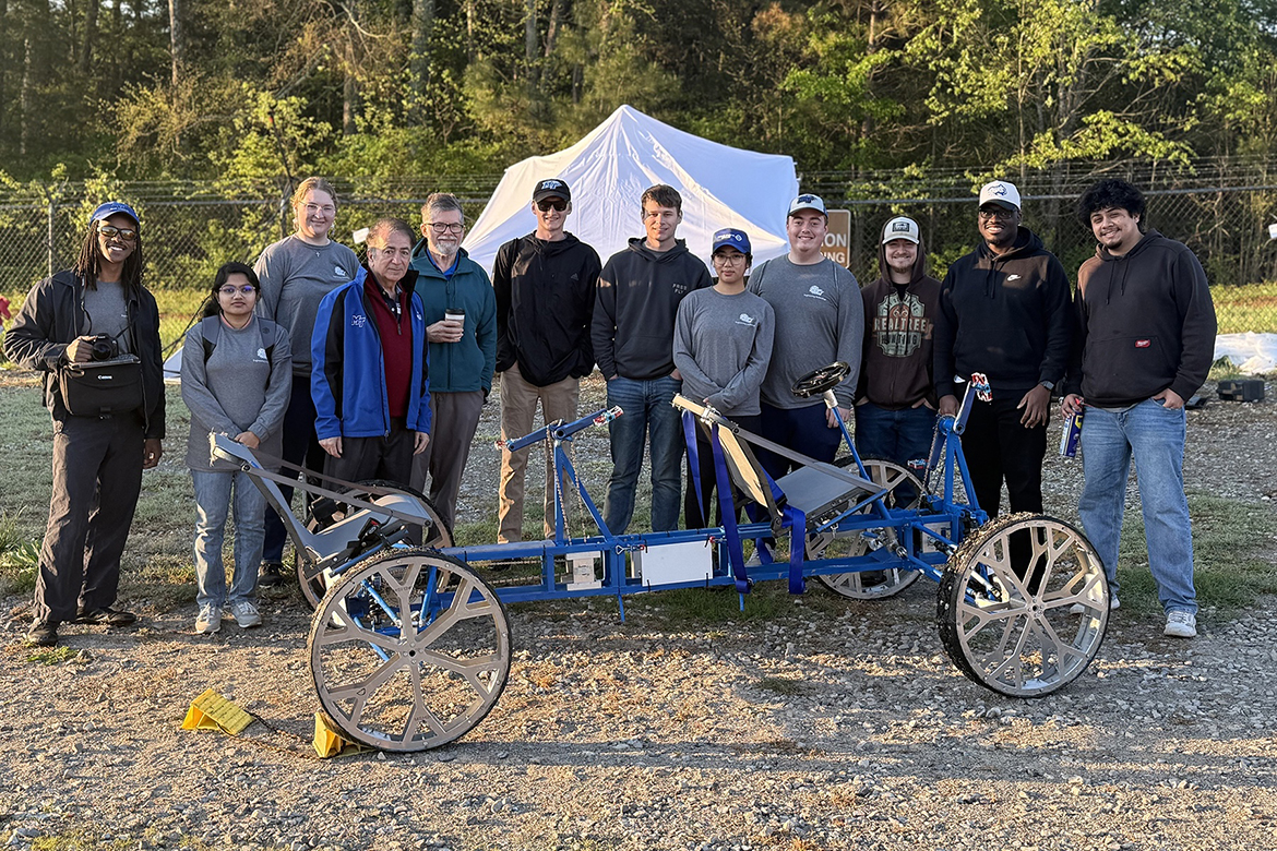 Shown with their entry nicknamed “Project 101,” Middle Tennessee State University  Engineering Technology Experimental Vehicles lunar rover team members, from left, Philip Sheffield, Mahina Ahmed Pranti, Lydia Ashby, Saeed Foroudastan, Rick Taylor, Domonic Dalton, Tyler Smith, Angela Thongdinharath, Max Brooks, Andrew Starkey, Demaine Williamson and Marco Montoya collaborated for a 13th place finish in the 2025 NASA Human Exploration Rover Challenge April 11-12 in Huntsville, Ala., at the Marshall Space Flight Center. (Submitted photo)