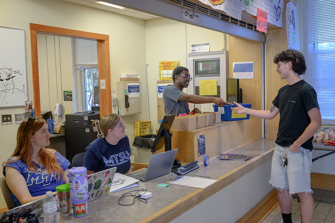 Middle Tennessee State University student Larry Lehmann, right, receives assistance from Housing and Residential Life staff members, from left, La'Nari Davis, Iris Brown and Eowyn Wagner, Wednesday, Aug. 20, on campus in Murfreesboro, Tenn. Nearly 2,700 students will be moving in at scheduled times into 11 residence halls, Scarlett Commons apartments and Greek Row housing. (MTSU photo by J. Intintoli)