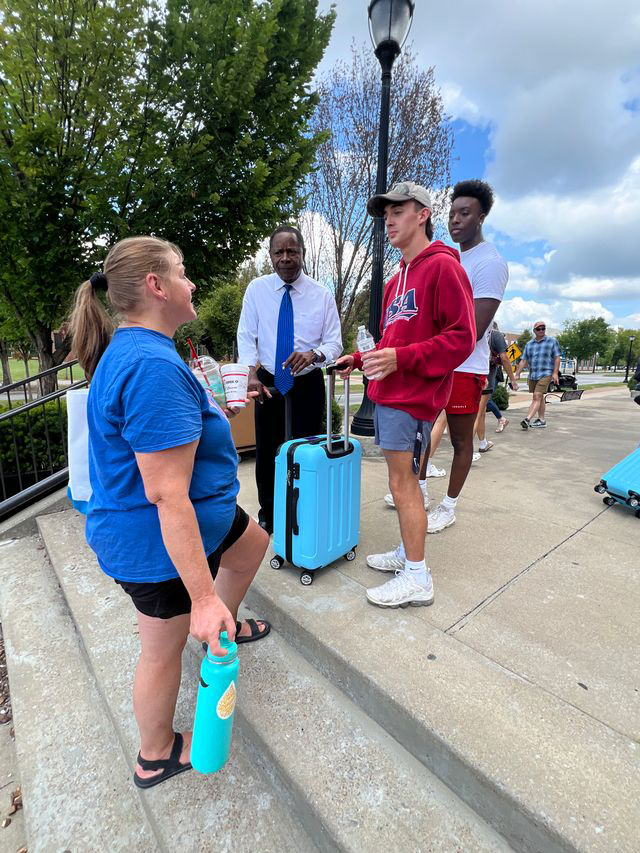 Middle Tennessee State University President Sidney A. McPhee, second from left, greets new students and their families as they move in to campus Friday, Aug. 22, the third and final day of new and returning students moving into campus housing in Murfreesboro, Tenn., awaiting the start of the 2025-26 academic year beginning with Monday, Aug. 25's first day of classes. (MTSU photo by Andrew Oppmann)