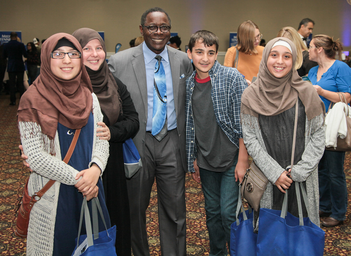 MTSU President Sidney A. McPhee, third from left, met future MTSU Blue Raiders Fatimah, left, mom Khadijah, Ahmed and Zaynab Alnassari in October 2019 during the True Blue Tour event in Nashville, Tenn., at the Millennium Maxwell House Hotel. The triplets are MTSU dual enrollment students, who made the fall Dean’s List. (MTSU file photo by John Goodwin)