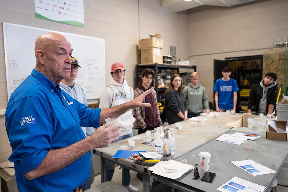 In the School of Concrete and Construction Management, Director Kelly Strong, left, tells prospective students at the spring True Blue Preview in March about opportunities in the programs before they made a concrete coaster to take home. MTSU holds fall preview Saturday events on Oct. 1 and Nov. 5. (MTSU file photo by Cat Curtis Murphy)