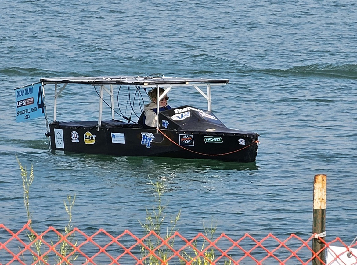 Middle Tennessee State University solar boat co-captain Lily Hardin of Nashville, Tenn., navigates the vessel recently during the annual Solar Splash competition near Springfield, Ohio. The team placed fourth overall in the international event. (Submitted photo)