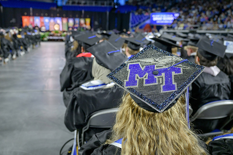 A proud spring graduate at Middle Tennessee State University shows university pride through their mortarboard as hundreds of graduates prepare to receive their degrees during the spring 2025 commencement ceremony held Friday, May 9, inside Murphy Center on the MTSU campus in Murfreesboro, Tenn. (MTSU photo by J. Intintoli)