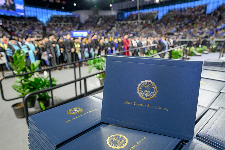 Stacks of diploma covers await Middle Tennessee State University Class of 2025 spring graduates at the first of three commencement ceremonies held Friday and Saturday, May 9-10, inside Murphy Center on the MTSU campus in Murfreesboro, Tenn. More than 2,375 graduates received their degrees. (MTSU file photo by J. Intintoli)