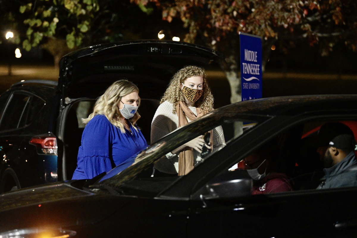MTSU Housing and Residential Life Director Michelle Safewright, left, and Associate Director Amy Korstange provide information and answer questions for a prospective student Thursday, Nov. 5, during the Drive-Thru College Fair at the Rutherford Parking Lot. The fair, which included MTSU colleges and departments and representatives from other schools from across Tennessee, was a way for high school students to obtain information since COVID-19 had canceled in-person college fairs this fall. (MTSU photo by Andy Heidt)