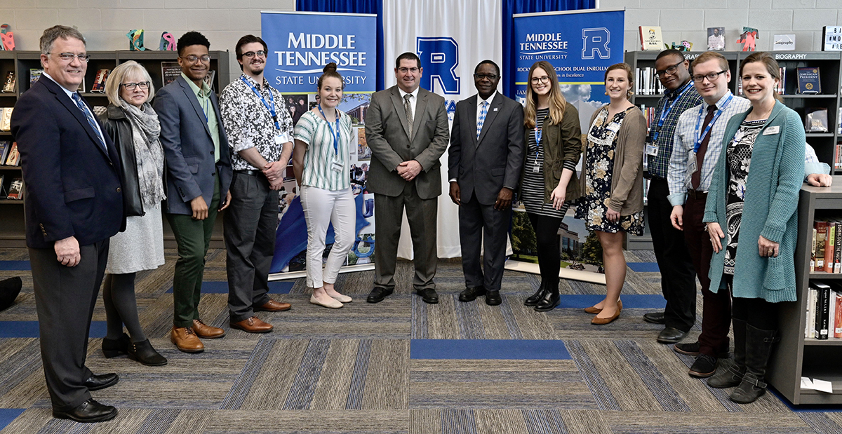 Seven MTSU student teachers working Thursday, March 5, at Rockvale High School attended the MTSU-Rockvale MOU agreement signing in the school library. They are shown with Provost Mark Byrnes, left, Student Affairs Vice President Deb Sells, Rockvale Principal Steve Luker and MTSU President Sidney A. McPhee, both center, and Heather Dillard, right, Womack Education Leadership associate professor, who directs the students’ secondary education Residency I program. (MTSU photo by Andy Heidt)