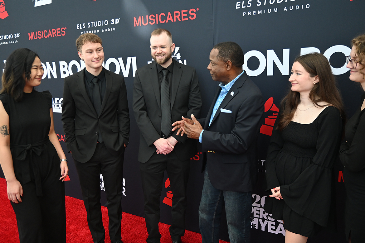 Middle Tennessee State University President Sidney A. McPhee, third from right, chats with students from the MTSU College of Media and Entertainment on the red carpet Friday, Feb. 2, in Los Angeles as the students worked the Recording Academy’s pre-Grammys black-tie charitable fundraising event honoring legendary rocker Jon Bon Jovi as MusiCares’ Person of the Year. For the ninth year, the university sent a delegation of students, faculty and administrators to Grammys to honor alumni nominees and network with industry professionals. (MTSU photo by Andrew Oppmann)