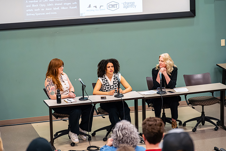 Country music artist Julie Williams, center, makes a point as she launches a collaborative multicity college tour titled “Green Room Conversations” with a panel discussion March 27 in the College of Education Building at Middle Tennessee State University in Murfreesboro, Tenn. The tour’s purpose is to raise awareness about sexual harassment in the music industry. Also pictured is MTSU College of Media and Entertainment Dean Beverly Keel, right, and fellow panelist Maggie Arthur, director of Calling All Crows, a partnering organization in the series. (Photo courtesy of The Change Agent·cy)