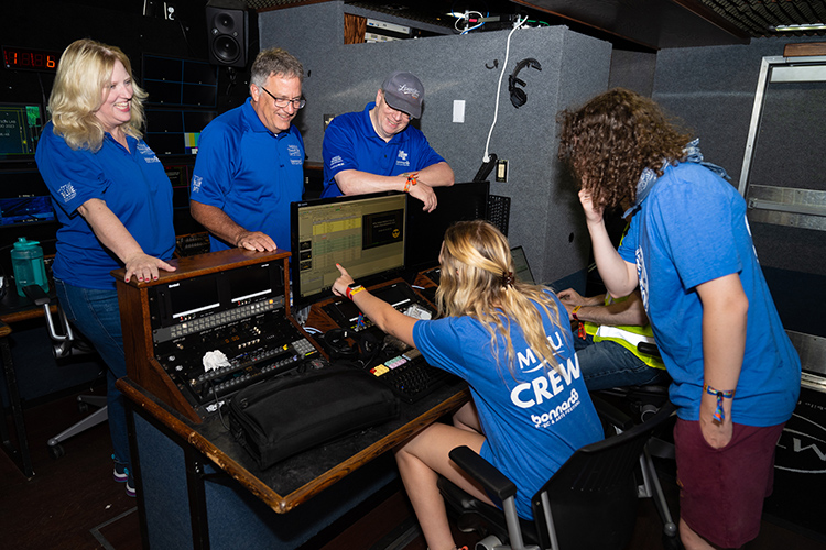 MTSU Media and Entertainment Dean Beverly Keel, left, University Provost Mark Byrnes and associate professor Bob Gordon chat with students working at this year’s Bonnaroo Music and Arts Festival. They are in MTSU’s almost $2 million Mobile Production Lab, known affectionally as “The Truck,” will be used to record 25 performances at this year’s four-day event. (MTSU Photo by James Cessna)