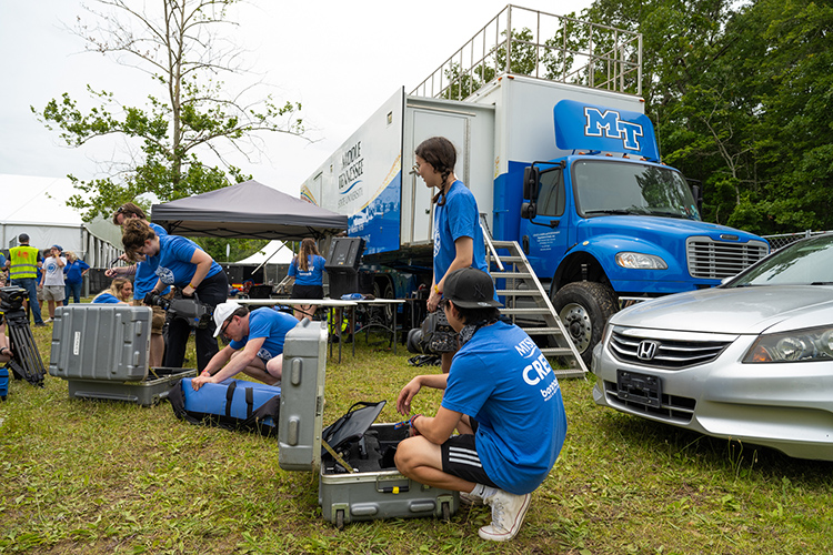 A team of about 50 students and faculty from MTSU’s College of Media and Entertainment are working at this year’s Bonnaroo Music and Arts Festival. These crew members are front of MTSU’s almost $2 million Mobile Production Lab, known affectionally as “The Truck,” which will be used to record 25 performances at this year’s four-day event. (MTSU Photo by James Cessna)