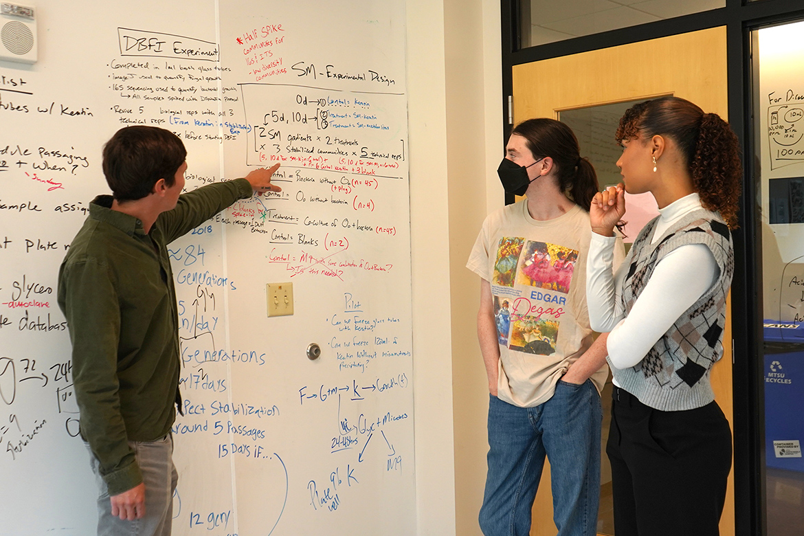From left, Middle Tennessee State University associate professor Donald Walker reviews research with Honors students Ian Wilson and Tatyana Martinez during the two students’ summer Research Experience for Undergraduates that took place on campus in Murfreesboro, Tenn. (MTSU photo by Robin E. Lee)
