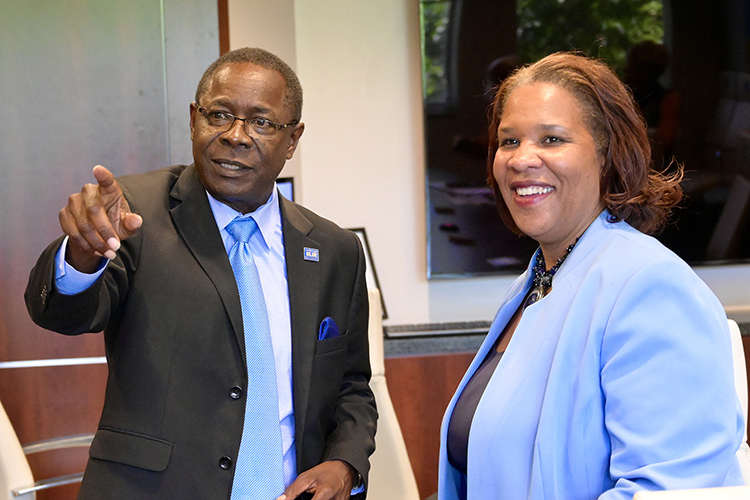 MTSU President Sidney A. McPhee shows Nashville State Community College President Shanna L. Jackson images of various campus buildings on display in a conference room in the Cope Administration Building on the Murfreesboro campus. (MTSU photo by Andrew Oppmann)