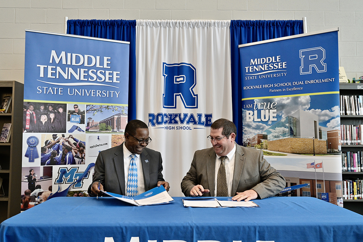MTSU President Sidney A. McPhee, left, and Rockvale High School Principal Steve Luker smile as they sign documents cementing the dual enrollment partnership Thursday, March 5, at the first-year high school in Rockvale, Tenn. Forty-five students are taking dual enrollment classes this semester and the number should more than double in 2020-21. (MTSU photo by Andy Heidt)