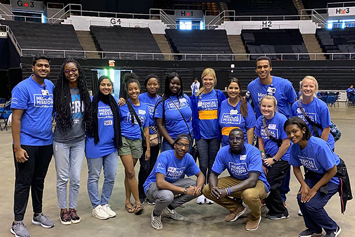 Volunteers at a Medical Mission at Home pose Sept. 30 at Municipal Auditorium in Nashville. Daviesha Carter, president of the MTSU chapter of the Minority Association of Pre-Medical Students, is fourth from left in the back row. Ella Morin, president of the MTSU chapter of the American Medical Student Association, is seventh from left in the back row. (Photo provided)