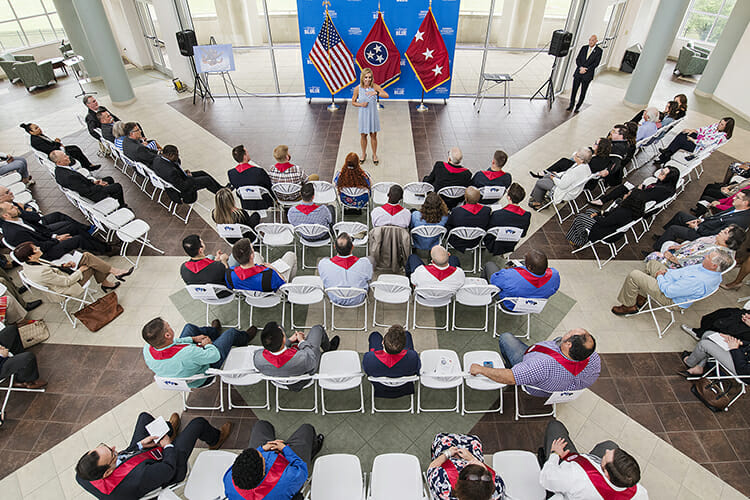 Dr. Hilary Miller, top center, director of the MTSU Daniels Veterans Center, explains graduating student veterans' role as alumni after commencement in May during the Graduating Veterans Stole Ceremony April 25 in the second-floor atrium of the Miller Education Center. (MTSU photo by Andy Heidt)