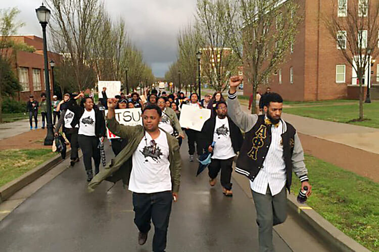Students march to the home of MTSU President Sidney A. McPhee on March 24, 2016, following the final meeting of the Forrest Hall Task Force to discuss the possibility of renaming the building that houses MTSU’s military science program. (Photo courtesy of the Albert Gore Research Center)