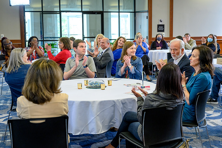Attendees applaud recipient of the 2022 Trailblazer Awards during MTSU's National Women's History Month Closing Ceremony March 29 at the Ingram Building. (MTSU photo by J. Intintoli)