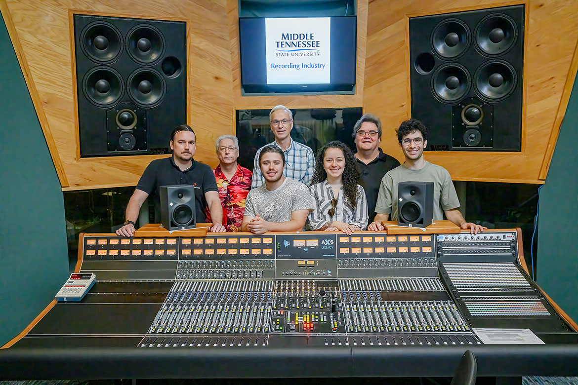 In this photo, Chris Dilday, Middle Tennessee Department of Recording Industry RIM IT Specialist, left, Alton Dellinger, RIM Engineer, Clarke Schleicher, RIM Hardware Maintenance, William Meckley and Inti Jimenez, Recording Arts and Technologies, Master of Fine Arts students, Bill Crabtree, RIM professor, and Franco Galleto also a Recording Arts and Technologies MFA student stand behind the new API audio board in Studio B housed inside of the College of Media and Entertainment. (Photo Andy Heidt)