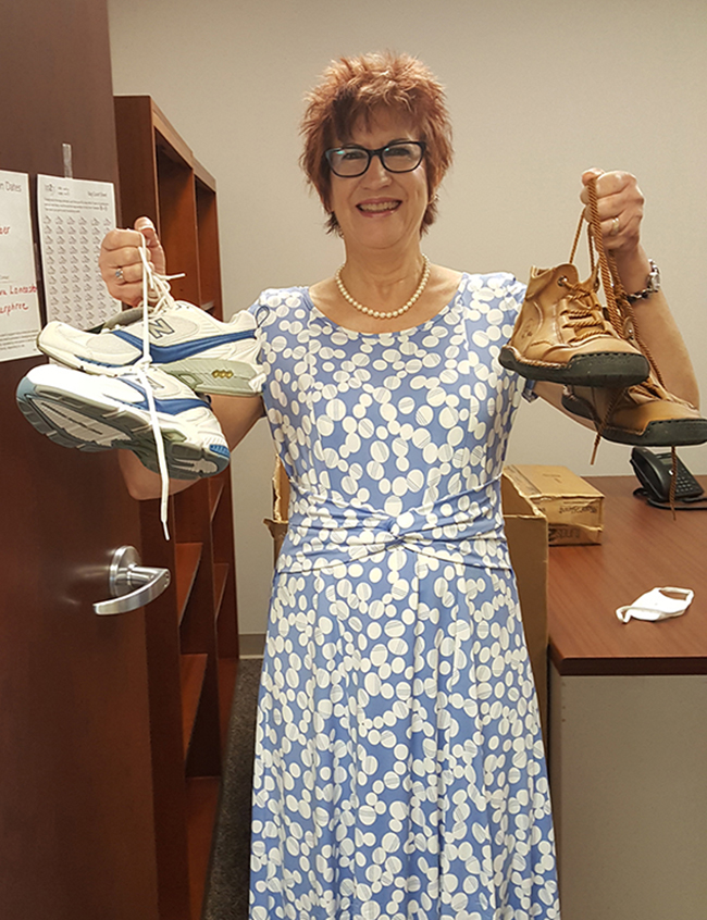 Dr. Barbara Lancaster, an assistant professor of nursing, holds some shoes donated as part of a drive to collect shoes for people in developing nations. Money based on the weight of the shoes and provided by Fund2Org will be donated to the American Heart Association. (Photo submitted)