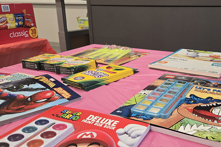 These watercolor books, standard coloring books, crayons, and refreshments purchased by Chapter 246 of The Honor Society of Phi Kappa Phi at Middle Tennessee State University in Murfreesboro, Tenn., await use by participants at the Watercolor and Coloring Book Night on Valentine’s Day co-hosted by PKP and the Ables Recreation Association, a nonprofit that serves individuals with intellectual and developmental disabilities. (Submitted photo)