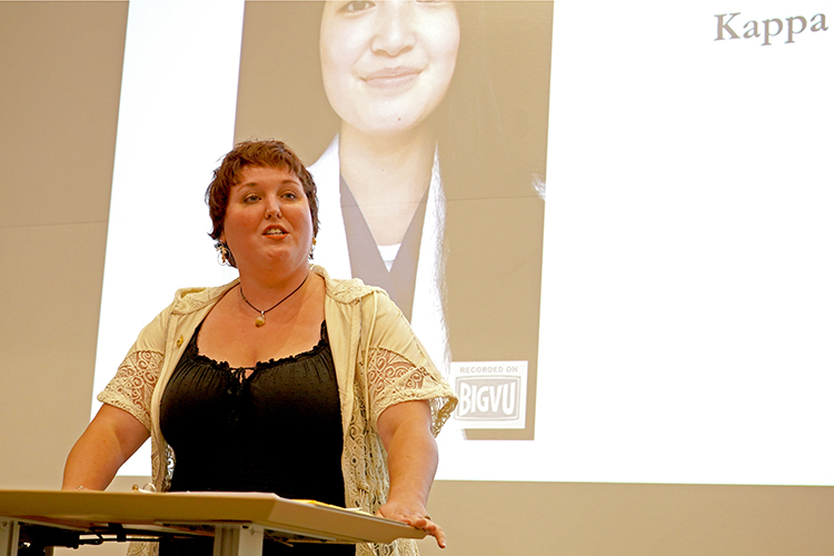 Middle Tennessee State University student Rachel Booher, a Japanese major and the Chapter 246 of Phi Kappa Phi Student Council president, concludes the organization’s fall induction ceremony with a photo 2022 Phi Kappa Phi Fellowship recipient Maria Hite displayed in background. (MTSU photo by Robin E. Lee)