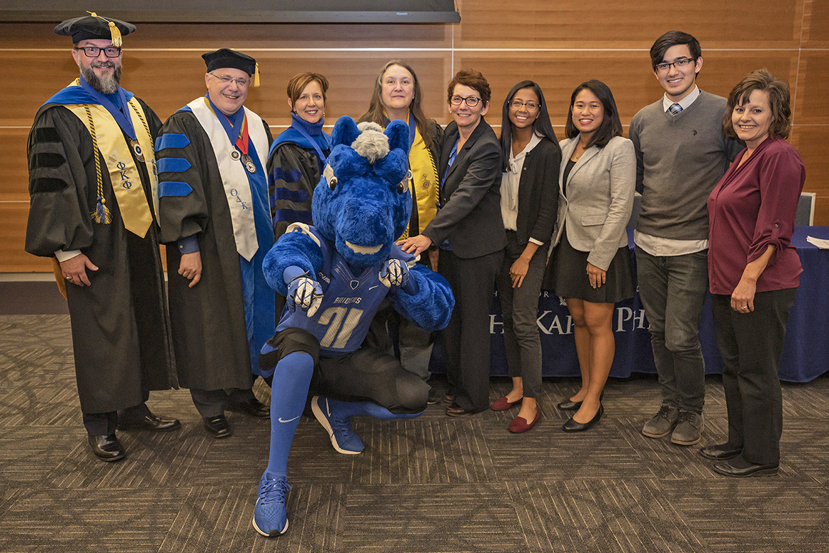 The officers of MTSU's chapter of Phi Kappa Phi pose with university mascot Lightning at the fall 2019 initiation ceremony Nov. 12 in the Student Union Building. From left, Dr. Philip Phillips, president and member of National Board of Directors; Dr. John Vile, fellowship coordinator and treasurer; Dr. Maria Bachman, president-elect; Gina Logue, secretary and public relations chair; Sandra Campbell, chapter coordinator; Jasmin Laurel, student vice president; Beatriz Dedicatoria, student vice president; Cody Maness, student vice president; and Dr. Dianna Rust, past president. (MTSU photo by Cat Curtis Murphy)