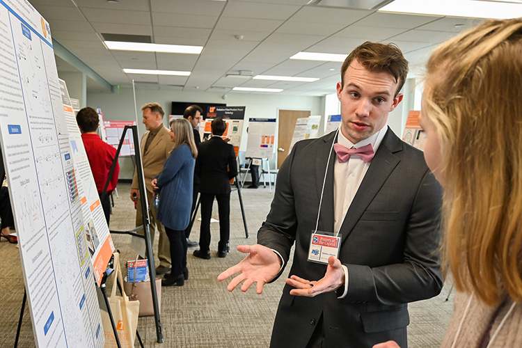 Matthew Johnson, Middle Tennessee State University undergraduate student and researcher, presents his chemistry research to a fellow student and researcher from another Tennessee public university at the annual Posters at the Capitol event held at the state Capitol in Nashville, Tenn., on Wednesday, Feb. 15, 2023. (MTSU photo by Stephanie Wagner)