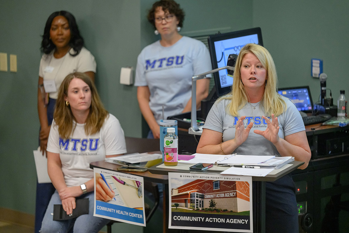 Sitting at right, Samantha Weir, an instructor in the Human Development and Family Science program at Middle Tennessee State University in Murfreesboro, Tenn., explains the parameters to participants in a recent poverty simulation held on campus. Also pictured are, from left, Alexis Trice, Davidson County UT/TSU Extension agent; Rebecca Oldham, assistant professor of Human Sciences; and Claire Cook, Human Sciences professor. The exercise was aimed at helping students build empathy and understanding for community members living below the poverty line. (MTSU photo by J. Intintoli)