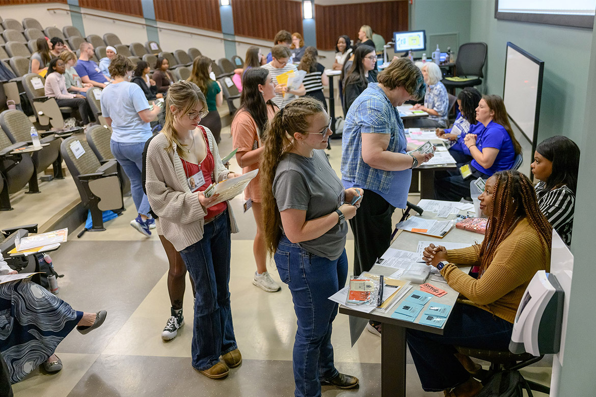 Participants in a poverty simulation held recently at Middle Tennessee State University in Murfreesboro, Tenn., experience a first-hand look at realities low-income families face. Participants were each assigned a character and family situation to navigate through various scenarios to mimic living below the poverty line. (MTSU photo by J. Intintoli)