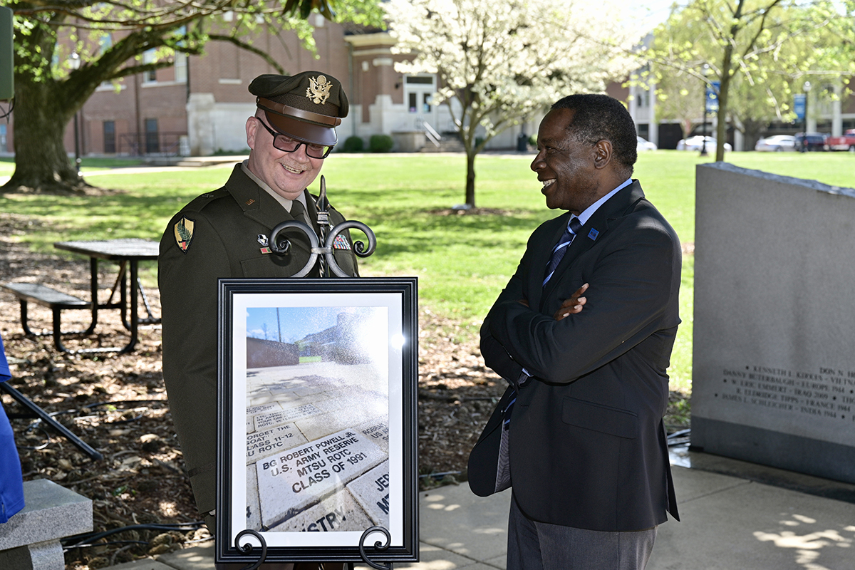 Brig. Gen. Robert S. Powell Jr., left, an MTSU alumnus, and university President Sidney A. McPhee share a laugh following the Monday, April 12. ceremony honoring Powell, now the 17th general officer to emerge from the 71-year ROTC program. MTSU presented a framed portrait of the brick, which has been placed at the Veterans Memorial site. (MTSU photo by Andy Heidt)
