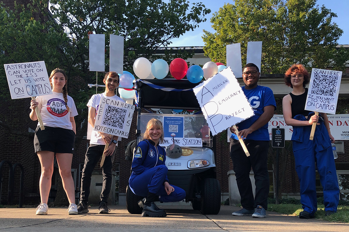 In this undated file photo outside the Paul W. Martin Sr. Honors Building on the Middle Tennessee State University campus in Murfreesboro, Tenn., MTSU students, from left, Victoria Grigsby, Marcus Rosario, Nancy Prescott, R.J. Ware and Dante Buttrey promote the petition to make university campuses polling places in Tennessee as part of the MTSU American Democracy Project. (Photo courtesy of the American Democracy Project at MTSU)