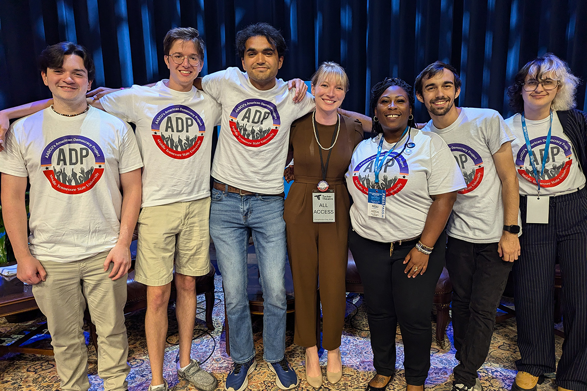 In this September 2024 file photo, Middle Tennessee State University graduate student Nancy Prescott, center, and fellow MTSU American Democracy Project members pose for a group photo at the Constitution Day speaking engagement for former Vice President Mike Pence inside Tucker Theatre on the MTSU campus in Murfreesboro, Tenn. (MTSU photo)