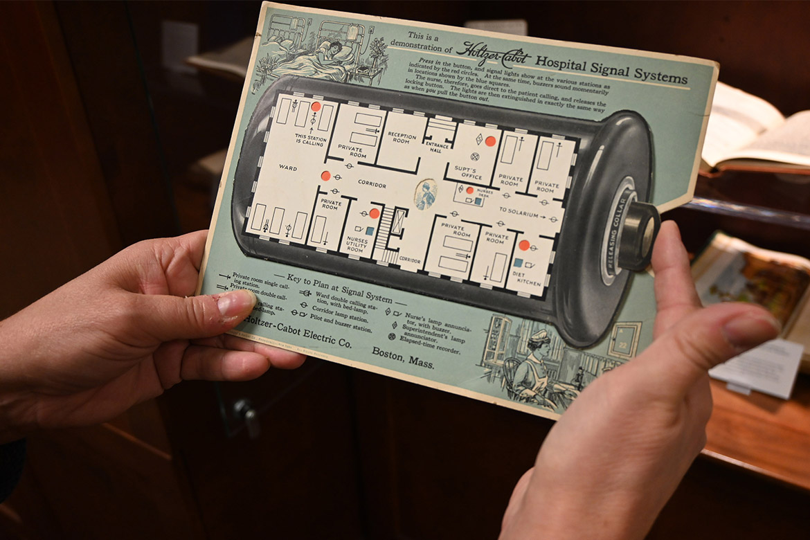 “Printing for the People: Press and Print in Everyday Life” exhibit in Special Collections at James E. Walker Library at Middle Tennessee State University displays this advertisement for a hospital paging system that salesmen could give out had a moving apparatus that demonstrated how the call button worked. The exhibit is on display through the end of the spring semester in Special Collections, located on the fourth floor. (MTSU photo by Nancy DeGennaro)