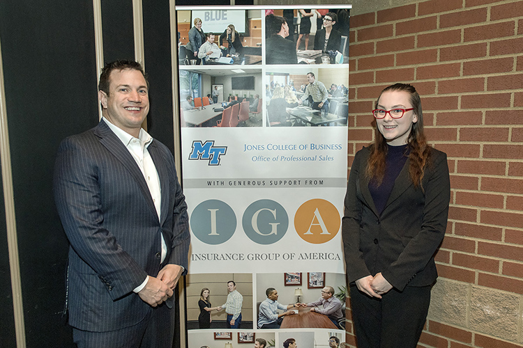 Jamie Noe, left, owner and founder of Insurance Group of America, is pictured with MTSU junior Christine Owens, the first student in the Professional Sales Concentration, at the February MTSU Professional Sales Program Advisory Board meeting at Jonathan's Grille in Murfreesboro. Noe was honored for IGA’s five-year, $100,000 contribution to the program. (MTSU photo by Andy Heidt)